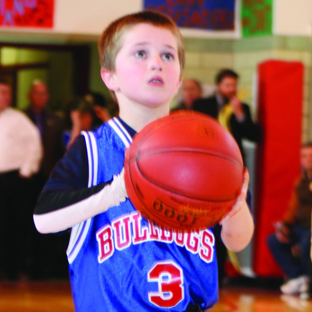 PHOTO BY CHUCK HOVEN Saturday, March 15, 2014, Vatican City League Ignatius Basketball Association Championship Game, St. Ignatius of Antioch School Gym, 10205 Lorain Ave: Tim Putka, of the North American College Bulldogs, focuses as he prepares to shoot a foul shot.