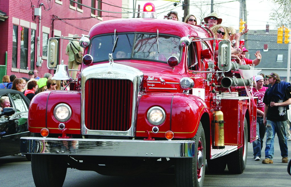 An old fire truck participating in the parade, is filled with Dyngus Day celebrants.