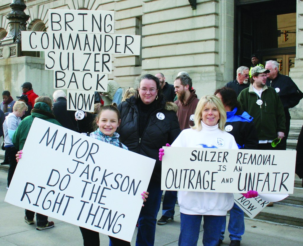 PHOTO BY CHUCK HOVEN March 31, 2014; Protest in Support of Reinstating Second District Commander Keith Sulzer, Front of Cleveland City Hall, E. 6th and Lakeside: (L-R) Denise McGuire, Tammy McCoy and Destiny Rice, age 11, display their signs to show their support for the effort to reinstate Keith Sulzer as Commander of the Second Police District. 