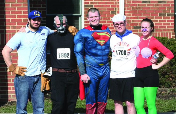PHOTO BY CHUCK HOVEN Saturday, April 12, 2014; Be Your Own Hero 5KRace and 1 mile run, West Side Community House, W. 93rd and Lorain Avenue: Many of the runners dressed as superheroes for the race. Here are Ziad Akel as Fix It Felix, the winner of the most creative costume; Ramzi Akel as Bane; David Budertscher as Superman, and the winners of the most colorful costume -- the team Brian Dawson as Barnacle Boy and Courtney Dawson as Mermaid Man. 