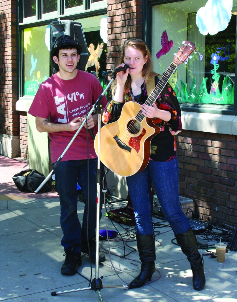 PHOTO BY DEBBIE SADLON Saturday, June 14, 2014; Party in Gordon Square, W. 65th & Detroit Avenue: Jarred Goldweber and Taylor Lamborn join in providing musical entertainment. The pair of local musicians say they have played together before at jam sessions held weekly at the Parkview (Wednesday nights at 10 p.m.) and at Brother’s Lounge (Thursday nights at 9 p.m.).