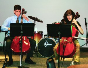 PHOTO BY JOE NARKIN Sunday, July 13, 2014; Grand Opening Performances of the Music Settlement at the New Bop Stop Location, 2920 Detroit Ave: Cellist Teacher Ida Mercer and Student Jim Toner perform an arrangement of classical and contemporary music at the grand opening of the Bop Stop venue. 