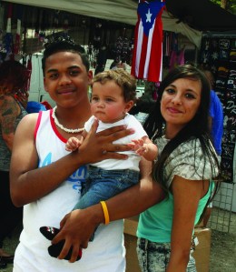 PHOTO BY JOE NARKIN Saturday, July 12, 2014; Festival Del Café, Club Alma Yaucana, 2674 W. 25th Street: Mariliana Claudio, Alexis Vargas, and eight-month old Gabriam enjoy a day of fun at the Festival Del Café. 