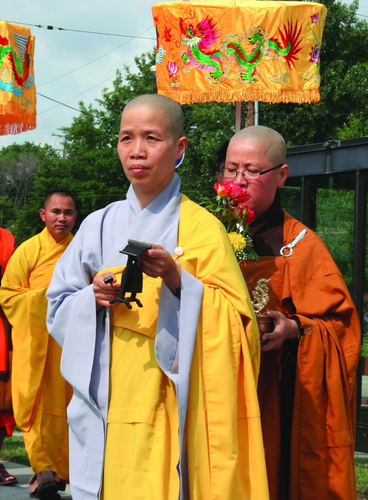 PHOTO BY CHUCK HOVEN Sunday, July 20, 2014; Celebration of 10th Anniversary of Quan Am Buddhist Temple, 11921 Bellaire Road: Buddhist nuns and monks walk in a procession from the temple to an outdoor tent where two hundred members and guests await their arrival to begin the celebration of the founding of the temple.