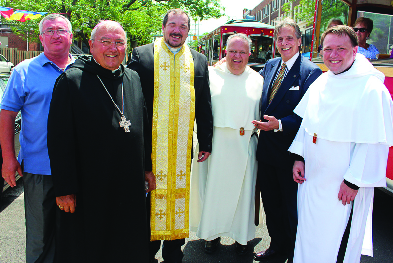 PHOTO BY ROBERT WEAKLEY Sunday, July 13, 2014; Fr. Petru Stanea’s 40th Birthday Celebration, St. Helena Romanian Byzantine Catholic Church, 1367 W. 65th Street: Fabian Barbolovici, President St. Helena Church Council, Cleveland Diocesan Bishop Gries, Fr. Petru Stanea, New Rector at St. Helena, Our Lady of Mount Carmel Rector Fr. Richard Rasch, Jack Craciun III, Executive Chair, St. Helena Property and Dev. Committee, Father Justin of Our Lady of Mount Carmel (OLMC). Bishop Gries and priests from Our Lady of Mount Carmel participating in the annual procession through the neighborhood during the OLMC festival, stop to greet those celebrating Fr. Stanea’s birthday at St. Helena’s. 