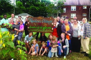 PHOTO COURTESY OF THE MIDWEST SAFETY TEAM Summer 2014, Madison’s Pathway Garden of All Seasons, W. 105th and Madison: Residents of the Madison’s Pathway Block Club enjoy a picnic in the garden. 