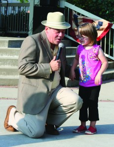 PHOTO BY CHUCK HOVEN Sunday, August 3, 2014; Westown Community Development Corporation Swinging’ Summer Concerts at Halloran Park: Kayla Readinger, age 6, visits with Frank Sinatra (Damion Fontaine) as the Rat Pack entertains the crowd. Readlinger came up to the area in front of the gazebo to dance with Fontaine.