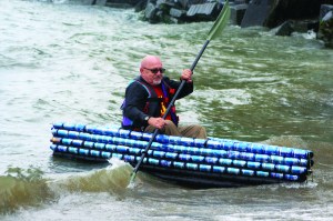PHOTO BY DEBBIE SADLON Saturday, September 6, 2014, Great Lake Erie Boat Float, Cleveland Metroparks Edgewater Park: Dwaine Gordon tests his craft, Little Bud, on the waters of Lake Erie. Gordon hauled the boat, made of Bud Light cans and held together with polyurethane, on a boat trailer from his home in Connellsville, Pennsylvania 