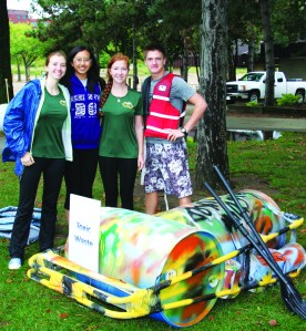 PHOTO BY DEBBIE SADLON Saturday, September 6, 2014, Great Lake Erie Boat Float, Cleveland Metroparks Edgewater Park: (L-R): Catherine Riordan, Eileen Huang, Kayla Blyler and Corey Kirkpatrick, members of a co-ed Boy Scout Venturing Group from Twinsburg, are prepared to test the seaworthiness of their craft, Toxic Waste, in the rough waters of Lake Erie. 