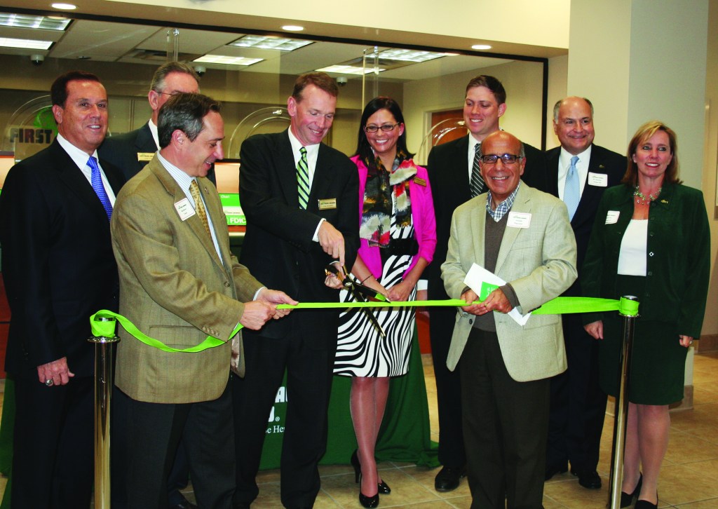PHOTO BY CHUCK HOVEN Thursday, October 16, 2014, Grand Opening of the Cleveland Branch of First Federal of Lakewood in the Gordon Square Arts District, 6610 Detroit Avenue: First Federal of Lakewood President and Chief Executive Officer Thomas J. Fraser (front center) prepares to cut the ribbon held by Ward 15 Councilman Matt Zone (front left) and Joseph Tegreene, Chairman of the Board of Directors of the Detroit Shoreway Community Development Organization (front right).  In the second row are: First Federal Lakewood Board Chair Ronald W. Dees, Director Gary R. Fix, Gordon Square Branch Manager Samantha Semick, First Federal Lakewood Director W. Charles Geiger III and First Federal Lakewood Director Rebecca Ruppert McMahon. 