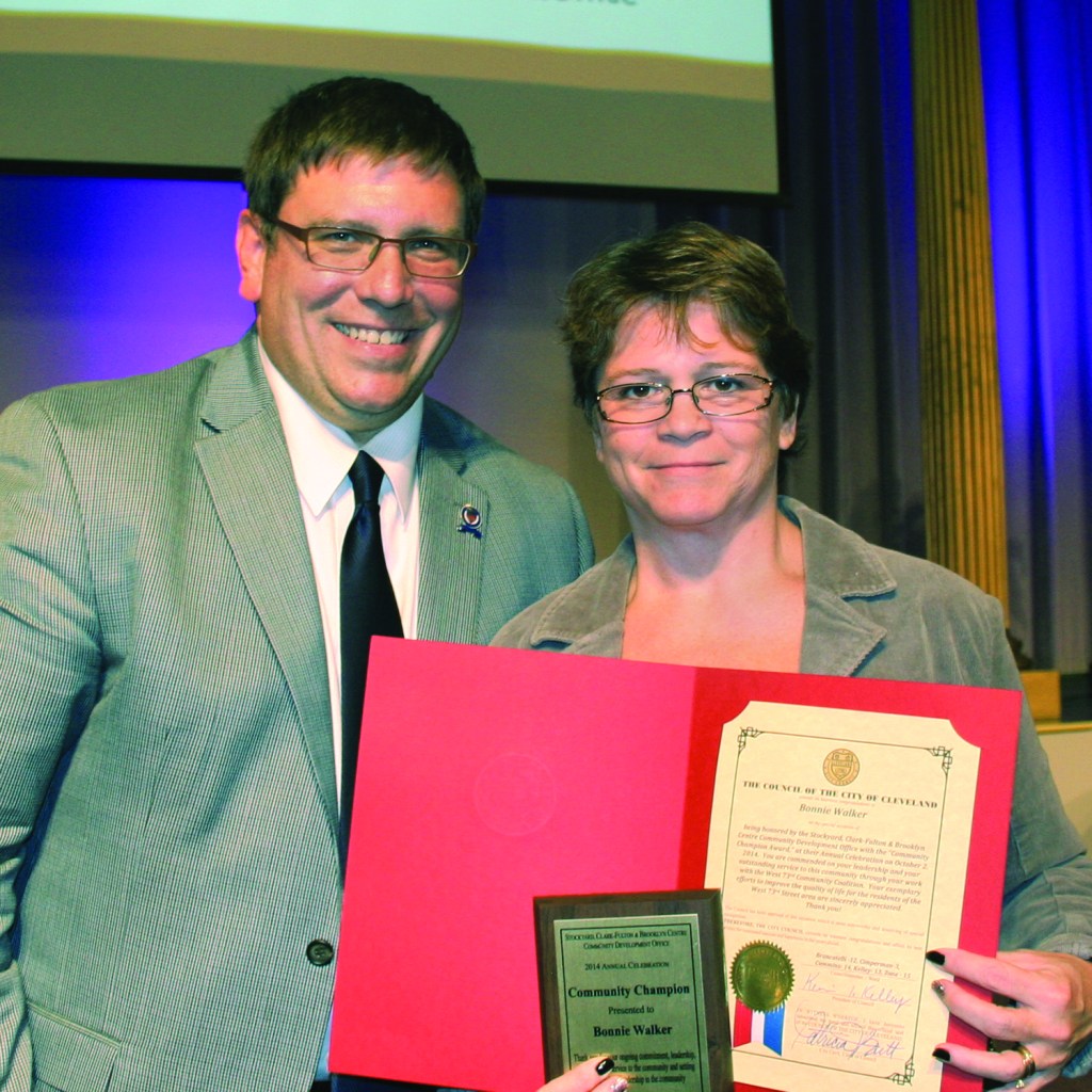 PHOTO BY CHUCK HOVEN Thursday, October 2, 2014; Stockyard, Clark-Fulton & Brooklyn Centre Community Development Office Annual Celebration, West 58th Street Church of God: Ward 3 Councilman Joe Cimperman presents Bonnie Walker with a Community Champion Award for her advocacy for the W. 70th and Camden area of the Stockyard neighborhood.