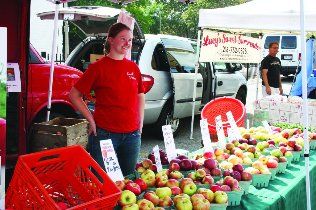 PHOTO BY DEBBIE SADLON Sunday, September 28, 2014; North Union Farmers’ Market at Ohio City, United Building Parking Lot, 2012 W. 25th Street: Abby Woolf of Woolf Farms in East Rochester Ohio sells apples and cider. 