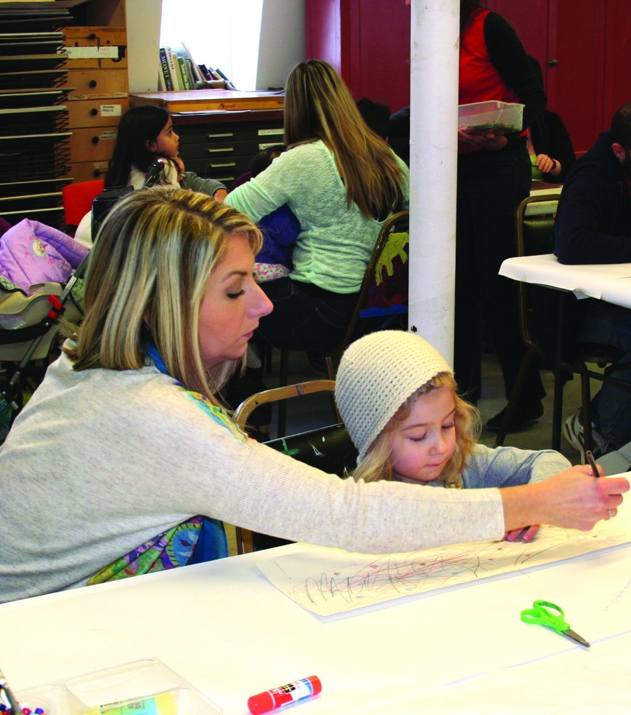 PHOTO BY DEBBIE SADLON Saturday, January 17, 2015; Family Open Studio at Art House, 3119 Denison Avenue: Karly Keirsey and her daughter Harper, age 3, work on an art project together. Art House holds a free Family Open Studio the third Saturday of each month from 1-3 p.m. Art House provides the materials for children accompanied by an adult to work on an art project.