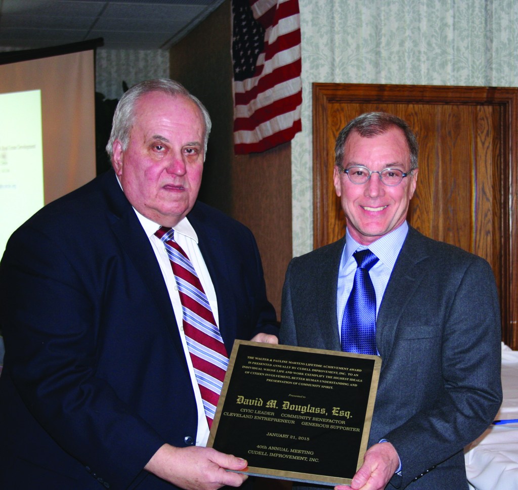 PHOTO BY CHUCK HOVEN Wednesday, January 21, 2015; Cudell Improvement’s 40th Annual Meeting, Brennan’s Banquet Center, 13000 Triskett Road: (L-R) In honor of his parents, Walter Martens Jr. presents David Douglas with the Walter & Pauline Martens Lifetime Achievement Award.  Douglas served as president of the West Boulevard Neighborhood Association in the early 1980s and wrote the grant for organizations recycling center. He also was involved over the years in assisting Simpson Methodist Church, St. Ignatius Church and Cudell Improvement. Cudell Improvement Executive Director noted Douglas’ reputation as a successful debt collector for the City of Cleveland.  