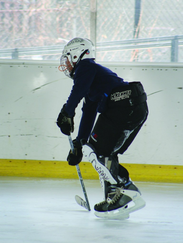 PHOTO BY DEBBIE SADLON Saturday, January 17, 2015; Halloran Park Skating Rink, 3550 W. 117th Street: Logan Helmick, age 13, a member of the Halloran Huskies Hockey Team, practices for an upcoming game. 
