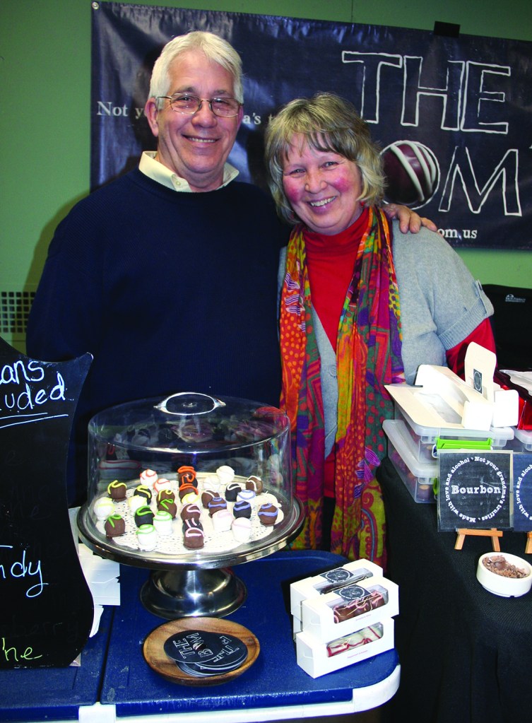 PHOTO BY CHUCK HOVEN Friday, February 20, 2015; Third Fridays at W. 78th Street Studios, W. 78th Street; North of Lake Avenue: Bill and Carolina Martin sell truffles made with love and alcohol at their stand – The BOM. The couple hopes rent a room for their shop in W. 78th Street Studios. 