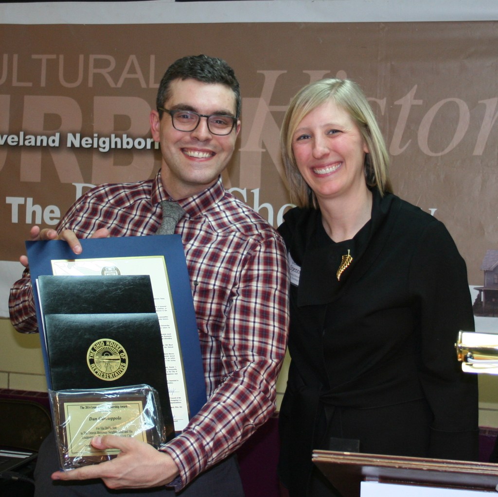 PHOTO BY CHUCK HOVEN Thursday, February 26, 2015; Detroit Shoreway Community Development Organization (DSCDO) 41st Annual Meeting, Our Lady of Mt. Carmel Church Pope John Hall: (L-R) Dan Carcioppolo receives the Irene Catlin Award from DSCDO Managing Director Jenny Spencer. Carcioppolo received the award for his commitment to improving the quality of life for residents of the neighborhood as well as for his role as a neighborhood leader involved in the Edgewater Hill Block Club as well as a number of committees of the DSCDO.