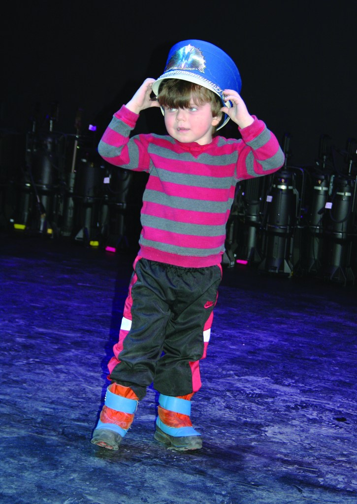 PHOTO BY CHUCK HOVEN Saturday, February 28, 2015; Near West Theatre Community Open House, 6702 Detroit Avenue: Nicholas Maistros, age 3, equipped with a hat from the prop box, acts on the new stage while speakers talk about what the new building will mean for Near West Theatre. Near West Theatre Executive Director Stephanie Morrison-Hrbek says now that Near West Theatre has a space of their own, she hopes to secure funding for new programs including programming for preschool age children.