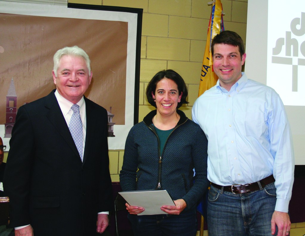 PHOTO BY CHUCK HOVEN Thursday, February 26, 2015; Detroit Shoreway Community Development Organization (DSCDO) 41st Annual Meeting, Our Lady of Mt. Carmel Church Pope John Hall: Jamye Jamison and Jonathan Karpick accept a Neighborhood Improvement award presented by Cuyahoga County Council President Dan Brady. Jamison and Karpick received the award for their work rehabbing their house at 6013 Franklin Boulevard.