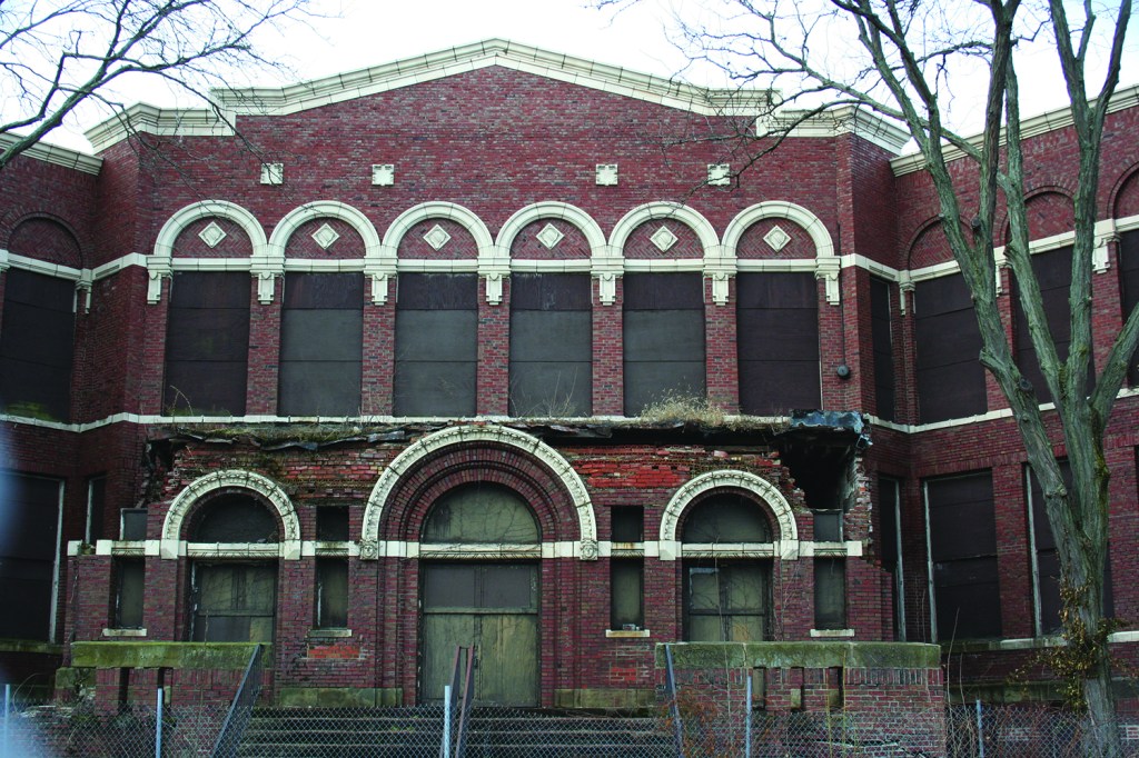 PHOTO BY DEBBIE SADLON Saturday, March 21, 2015; Watterson-Lake (old) School Building, W. 74th & Detroit Avenue: At a March 18th meeting area residents voted 22-3 to have Ward 15 Councilman Matt Zone petition to remove this historic building’s landmark status and make way for its demolition. After years of neglect, a report on the poor condition of the building’s masonry convinced most of those attending the meeting that saving the structure was no longer feasible. 