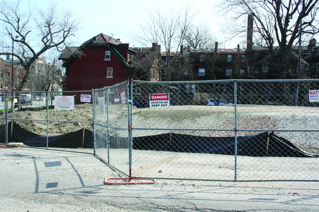 PHOTO BY DEBBIE SADLON Saturday, April 18, 2015; 8301 Detroit Avenue: The site of a proposed development to provide permanent supportive housing for veterans and the chronically homeless remains empty while plans for the site are revised. Neighbors challenged the original plan for the site in Common Pleas Court. The Court denied variances originally granted to the project by the Board of Zoning Appeals. Eden Inc., which will administer the housing planned for the site, is working with funders to redesign the proposed project so construction can begin in the fall. 