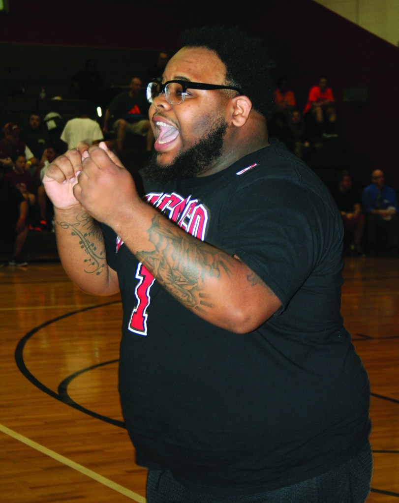 Saturday, April 18, 2015; Hoops for Children’s Miracle Network, Luis Munoz Marin School gymnasium, 1701 Castle Ave: A fan cheers on his team in the three-on-three basketball tournament. Teams from area Walmarts entered the competition including five teams of players from the Steelyard Walmart.