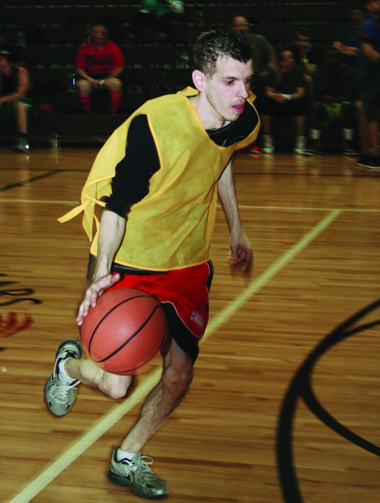 PHOTO BY DEBBIE SADLON Saturday, April 18, 2015; Hoops for Children’s Miracle Network, Luis Munoz Marin School gymnasium, 1701 Castle Ave: A Walmart employee participates in a three-on-three basketball tournament to raise money for the Children’s Miracle Network. The competition raised over $3,000 for the charity, which will directly benefit Rainbow Babies and Children Hospital patients and their families. 