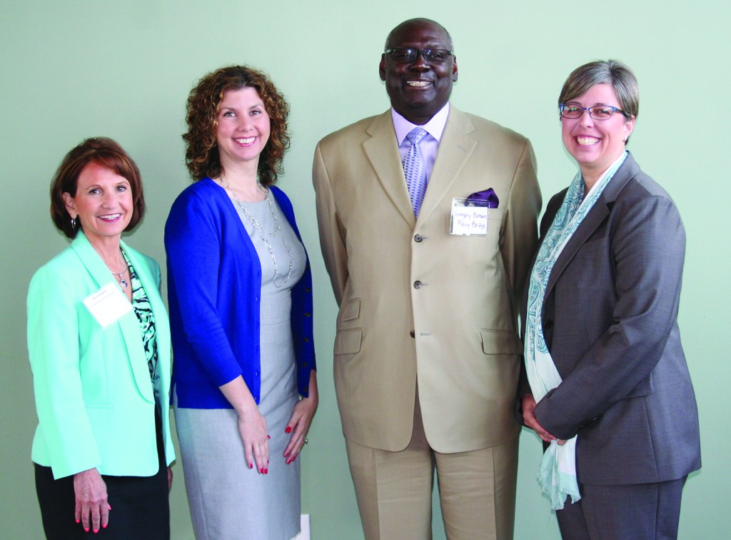 PHOTO BY DEBBIE SADLON Thursday, June 11, 2015; The Ariel International Center, 1163 E. 40th Street: The Health Improvement Partnership – Cuyahoga released its first ever Community Health Improvement Plan. Amongst the panelist helping to introduce the plan to the public are: (L-R) Rita Horwitz, RN BSN, director of business development and operations, Better Health Partnership; Erika Trapl, PHD, assistant professor of Epidemiology and Biostatistics, associate director of the Prevention Research Center for Healthy Neighborhoods and director of the Survey Development Lab at CWRU; Greg Brown, executive director at Policy Bridge; and Heidi Gullett, MD, MPH, assistant professor, Case Western Reserve University (CWRU) School of Medicine.