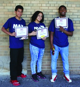 PHOTO BY DEBBIE SADLON Friday, June, 26, 2015; Max Hayes Career and Technical High School Summer Camp, 4600 Detroit Avenue: Students participating in the summer camp, eighth grade graduates entering the ninth grade, participated in a competition with the cars they designed and created in the summer camp. First place winners in the three categories of the completion are: (L-R) Angel Padilla for best design; Amanda Garcia for the car that traveled the farthest when sent down the racing ramp; and Ato Mungin for the fastest car.