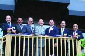 PHOTO BY CHUCK HOVEN Thursday, June 25, 2015; Templin-Bradley Co. Lofts ribbon cutting and dedication ceremony, 5700 Detroit Avenue: (L-R) Greg Baron, Director of Real Estate Development Detroit Shoreway Community Development Organization (DSCDO); Albert (Chip) Marous, President, Marous Brothers Construction; Guy Ford, Director of Legislative Affairs, Ohio Housing Finance Agency; Jeff Ramsey, Executive Director Detroit Shoreway Community Development Organization (DSCDO); Brian Langmeyer, Vice President Development, Ohio Capital Corporation for Housing; Michael Cosgrove, Assistant Director Community Development City of Cleveland; and Joe Tegreene, Chairman DSCDO Board of Trustees. 