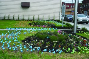 PHOTO BY CHUCK HOVEN Thursday, June 25, 2015; Templin-Bradley Co. Lofts ribbon cutting, dedication ceremony, and pubic art unveiling 5700 Detroit Avenue: Garden Mirrors, a public art piece by artist Steve O’ Hearn, is installed on the front lawn. The artist planned the piece to capture “the affection Cleveland residents and visitors once had for the test garden showcased on the front lawn of the Templin-Bradley building.” The Templin Bradley Company, once the country’s largest distributer of seeds, bulbs and plants, used its front lawn as a test garden. 