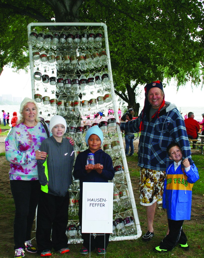 PHOTO BY DEBBIE SADLON Saturday, September 12, 2015; Great Lake Erie Boat Float, Edgewater Park: Judges gave the award for the “most enthusiastic” team to the builders of the Hausenfeffer, a craft built largely of empty plastic coke bottles. Team members are: Al Demor, Julie Demor, Joe Adams, age 10, Cameron Adams, age 7, and Colton Krafchek, age 5. The team was formed after the family attended last year’s Great Lake Erie Boat Float. 