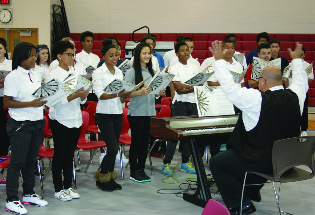 PHOTO BY DEBBIE SADLON Thursday, September 24, 2015; John Marshall High School Ribbon Cutting Ceremony, 3952 W. 140th Street: Members of the John Marshall Choir add their voices to the celebration of the opening of their new school. 